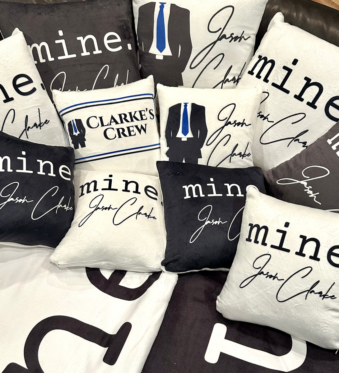 JASON CLARKE Small White Throw Pillow with "mine." Logo Addicted To