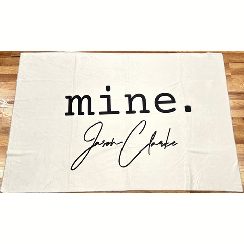 JASON CLARKE White Throw Blanket with "mine." Logo